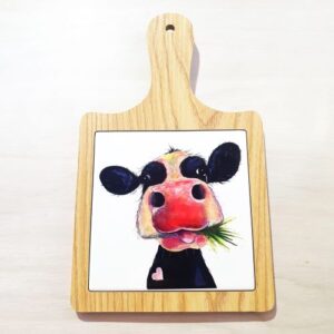 Cartoon cow eating grass wooden cheeseboard